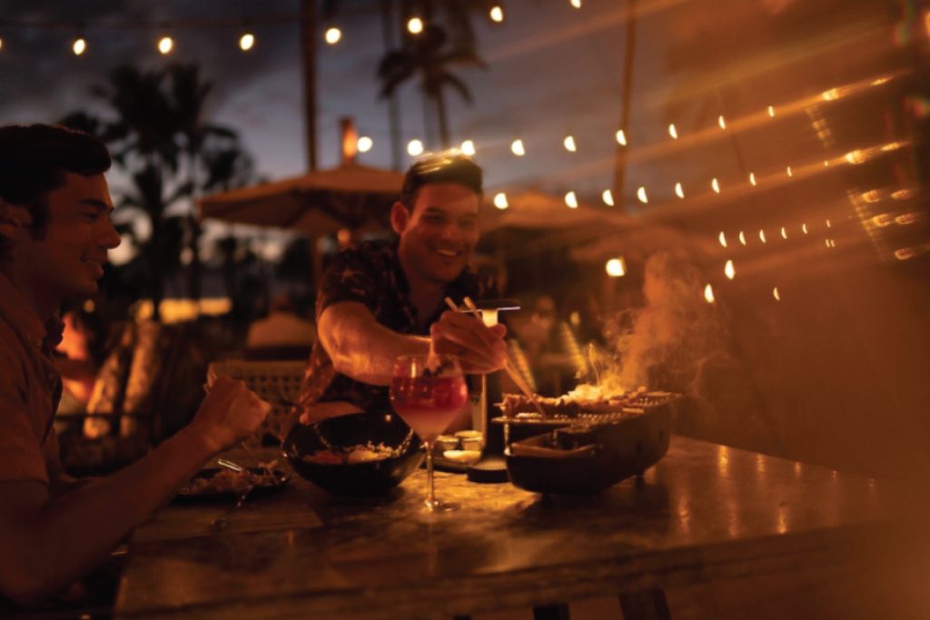 People enjoying a restaurant outdoors